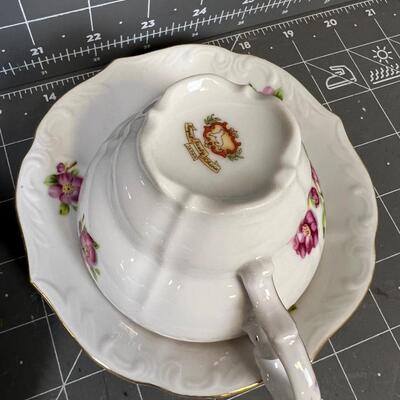 2 Tea Cups and Saucers: white with flowers and Yellow with Flowers