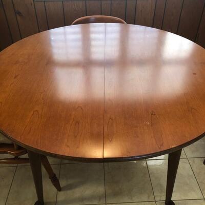 maple round or oval table (3 leaves) with 6 barrel back chairs