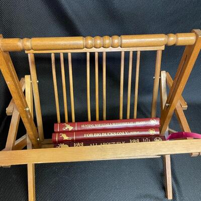 Wooden magazine rack with books