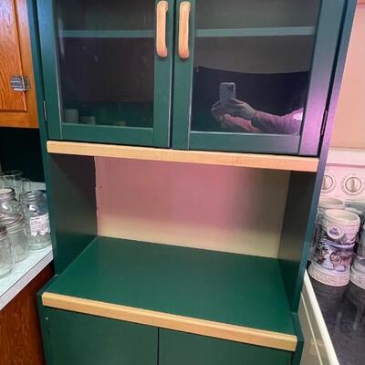 Green kitchen storage cabinet