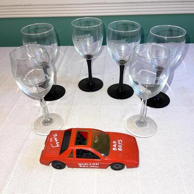 Lot 150 Lot 6 Wine Glasses "American Lemons Series" Black & Clear Stems Plastic Car