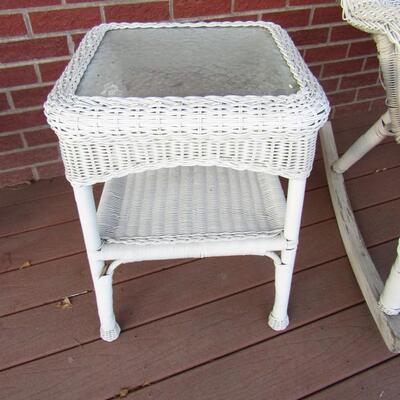 LOT 6  OUTDOOR WICKER ROCKER AND GLASS TOP SIDE TABLE