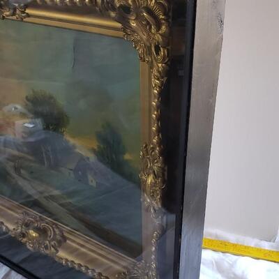 Original painting with ornate gold frame under glass