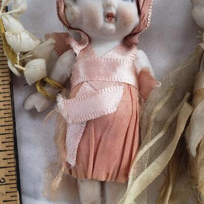 3 kewpie dolls