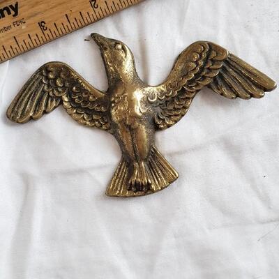 Vintage brass bird ready for hanging