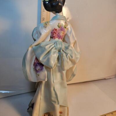 Tall porcelain/ bone China figure.
