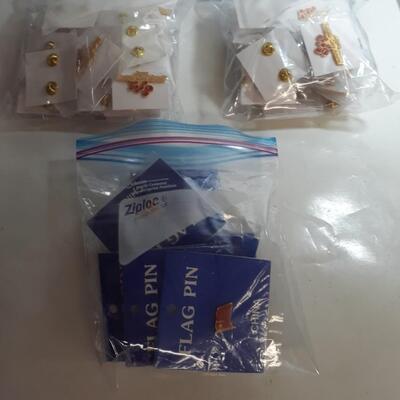 Lot of 12 China flag pins and 63 Amgen patient care award pins