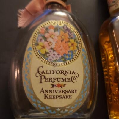 Early Avon bottles perfume one is full
