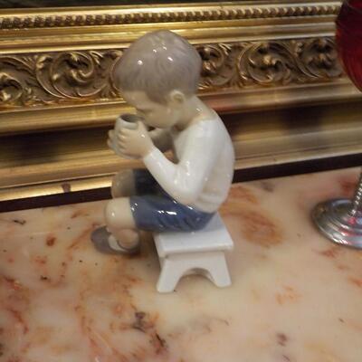 LLardro figurine of little boy.