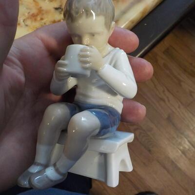 LLardro figurine of little boy.