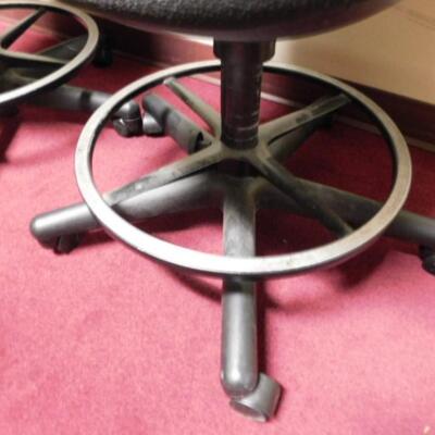 Pair of Black Cushioned Swivel Office Chairs with Metal Ring Footrests