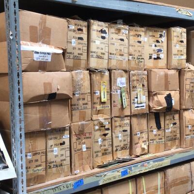 Approximately 30 boxes of zipper pulls