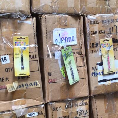Approximately 30 boxes of zipper pulls