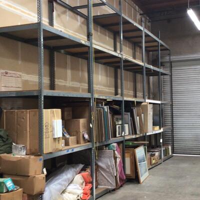 Five shelving units empty, proximately 20 feet high by 6 feet wide and 4 feet deep each