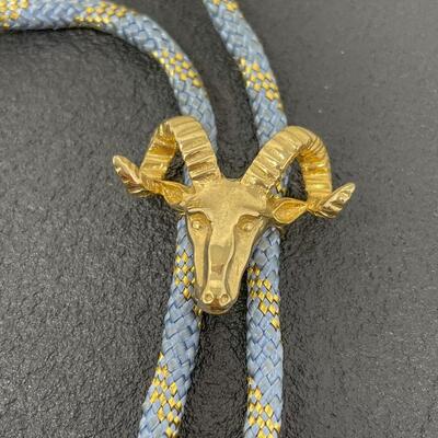 BLUE & GOLD WOVEN BOLO TIE W/ RAMâ€™S HEAD SLIDE