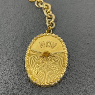 VINTAGE NOVEMBER GOLD TONED KEYCHAIN W/ GEM