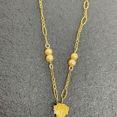 VINTAGE ORNATE GOLD TONED NECKLACE W/ AMBER COLORED STONE