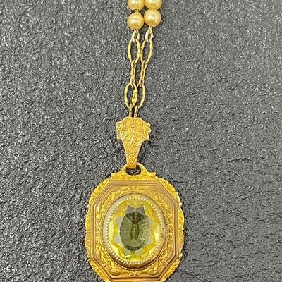 VINTAGE ORNATE GOLD TONED NECKLACE W/ AMBER COLORED STONE