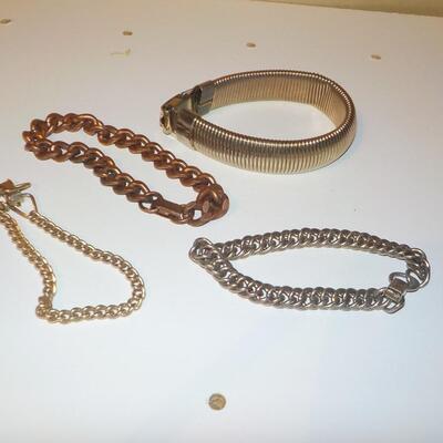 4 Metal designer Bracelets.