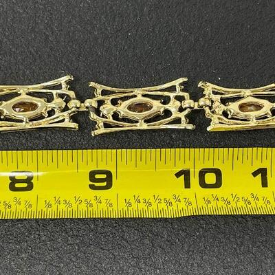 VINTAGE GOLD TONED PANEL BRACELET W/ ORANGE STONES