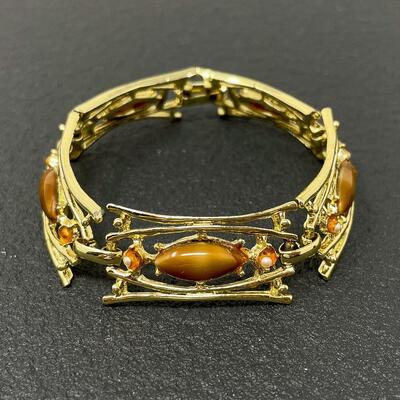 VINTAGE GOLD TONED PANEL BRACELET W/ ORANGE STONES