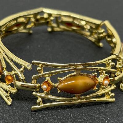 VINTAGE GOLD TONED PANEL BRACELET W/ ORANGE STONES