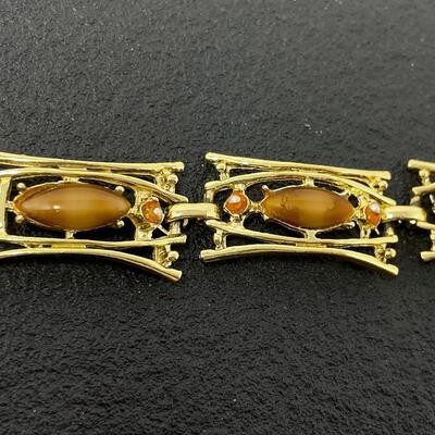 VINTAGE GOLD TONED PANEL BRACELET W/ ORANGE STONES