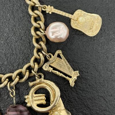 VINTAGE GOLD TONED CHARM BRACELET - MUSIC INSTRUMENTS & STONES
