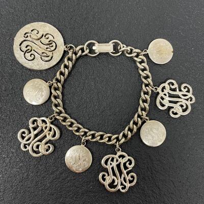 VINTAGE SILVER TONED CHARM BRACELET