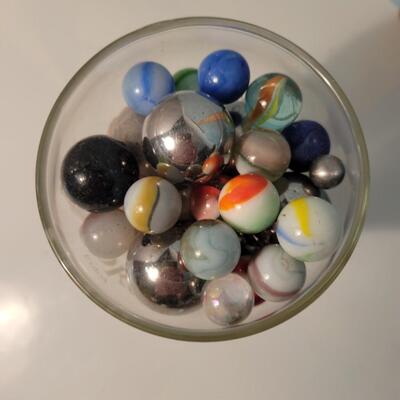 Marbles and steelies in Coca-Cola glass
