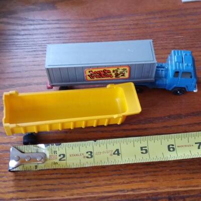 LOT 33  VINTAGE TOOTSIE TRUCK AND TWO TRAILERS
