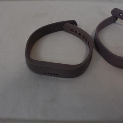 Fitbit With Charger and Two Purple Straps
