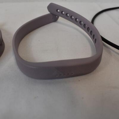 Fitbit With Charger and Two Purple Straps