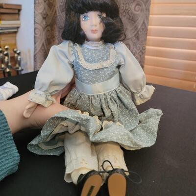 Porcelain doll dressed in Blue
