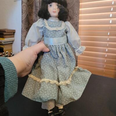 Porcelain doll dressed in Blue