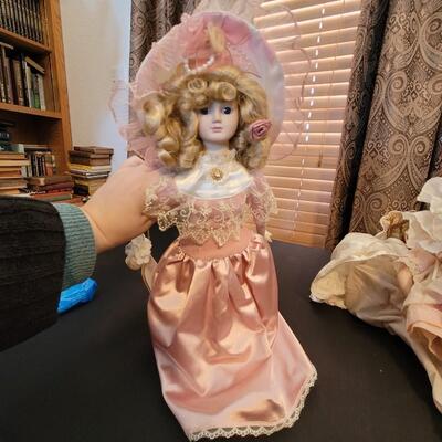Beautiful porcelain doll in pink