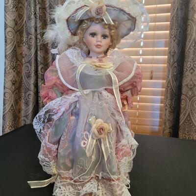 Beautiful porcelain Stand up doll with flowers