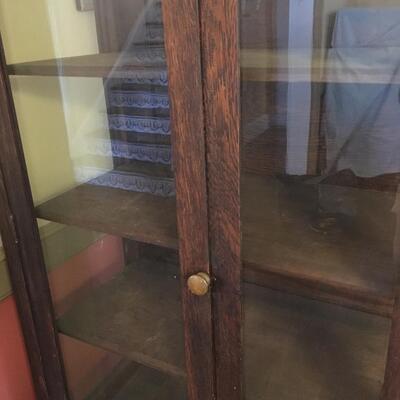 Antique display case with shelves