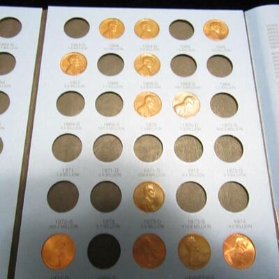 LOT 53  COIN COLLECTORS BOOKS WITH A FEW PENNIES IN ONE BOOK
