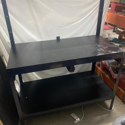 B2 light weight work bench, wood top, magnetic strip along the top, no drawers,  and power cord insert along the side.
