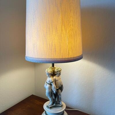 Vintage lamp with three children at base