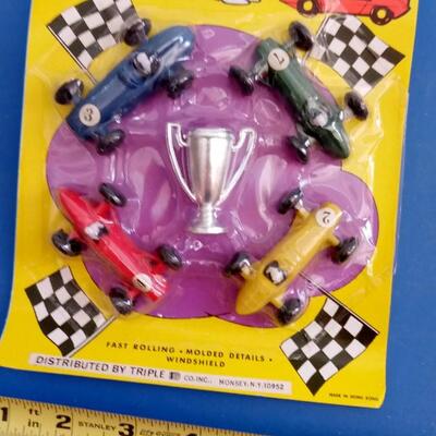 LOT 89  VINTAGE PLASTIC TOY RACE CARS AND MOTORCYCLES