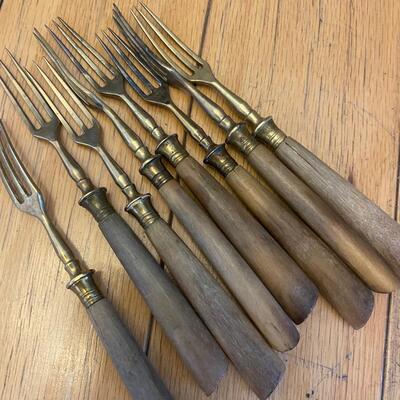 Eight brass pickle/oyster forks charcuterie !