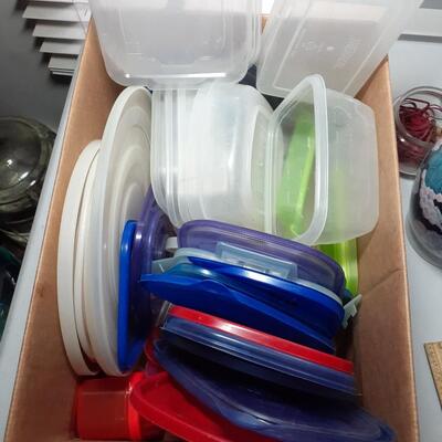 Box of plastic storage lids and containers