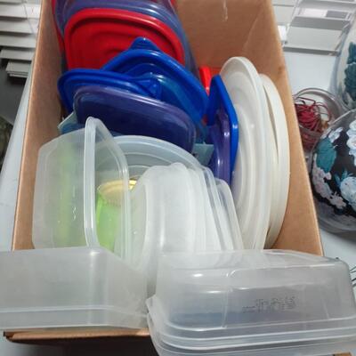 Box of plastic storage lids and containers