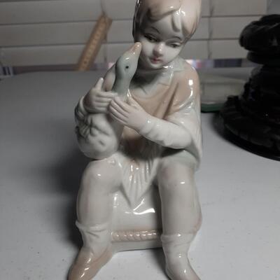 6in tall porcelan Boy with Goose