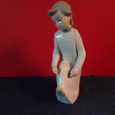 LOT 26.  REX FIGURINE