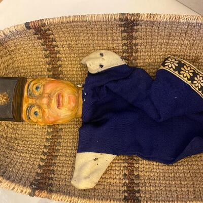 Eleven antique clay head puppets