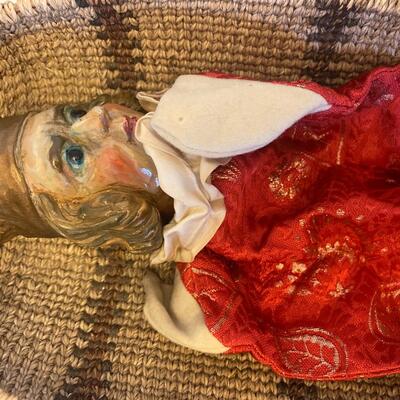 Eleven antique clay head puppets