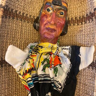 Eleven antique clay head puppets